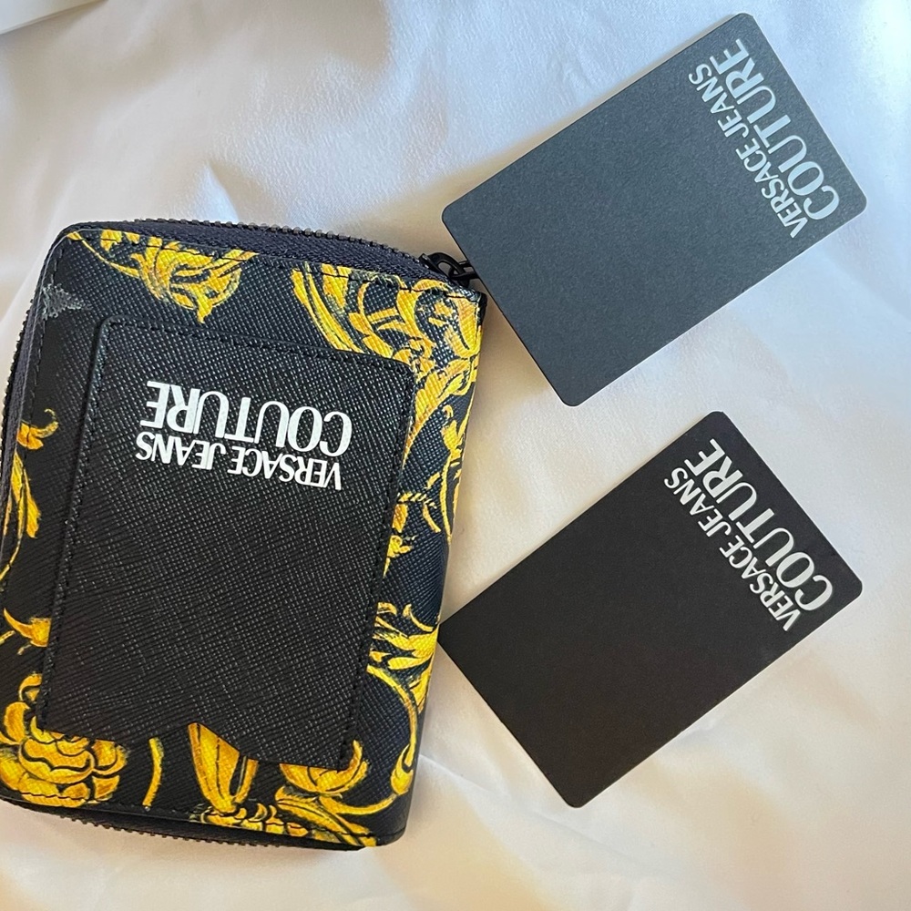 Versace Jeans Coutour wallet. Like new. Half the size of a long wallet.
